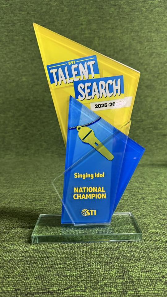 Gold trophies and engraved awards in studio lighting